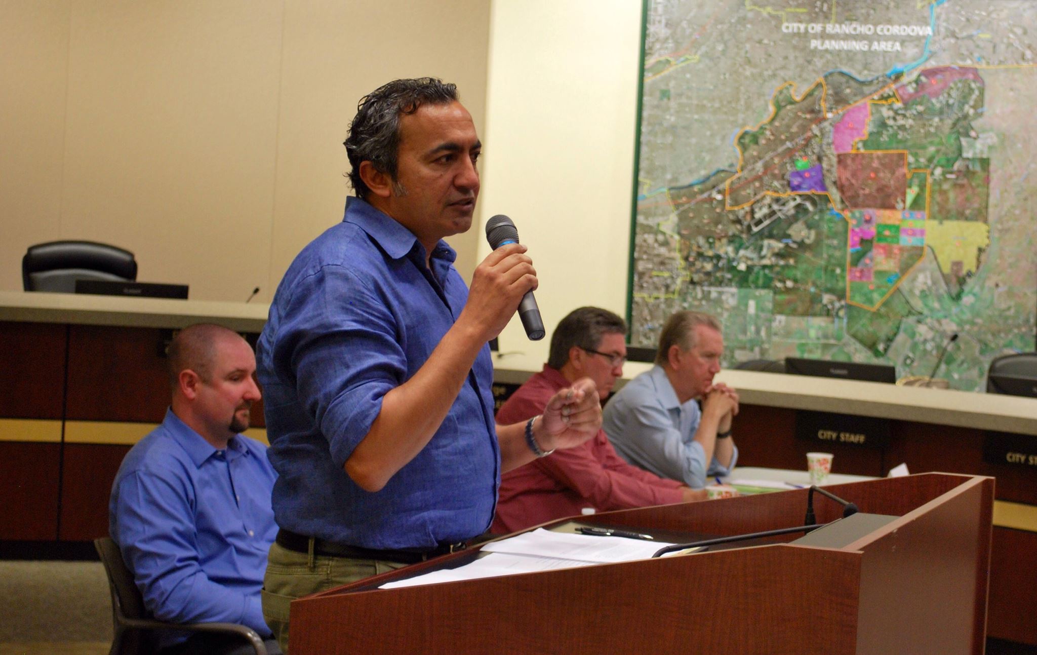 Rep. Bera at podium, community forum, Rancho Cordova